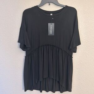 Women’s black peplum style top size medium, new with tags.